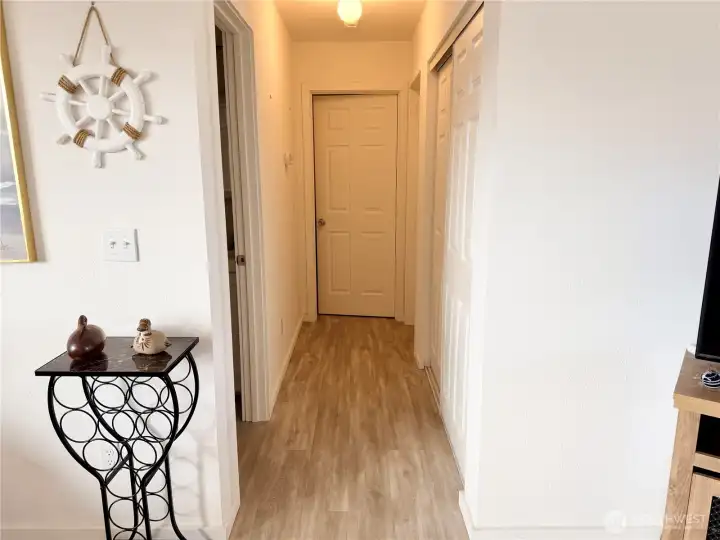 Hallway to guest bathroom and two bedrooms