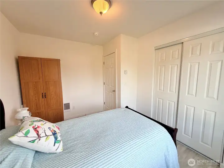 Another view of guest bedroom with included armoir and bed