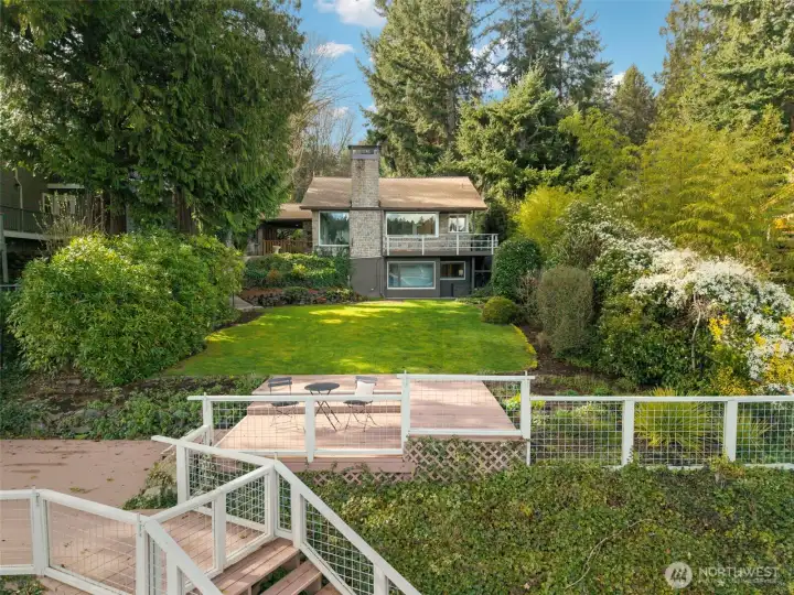 Private back yard with stairs to water