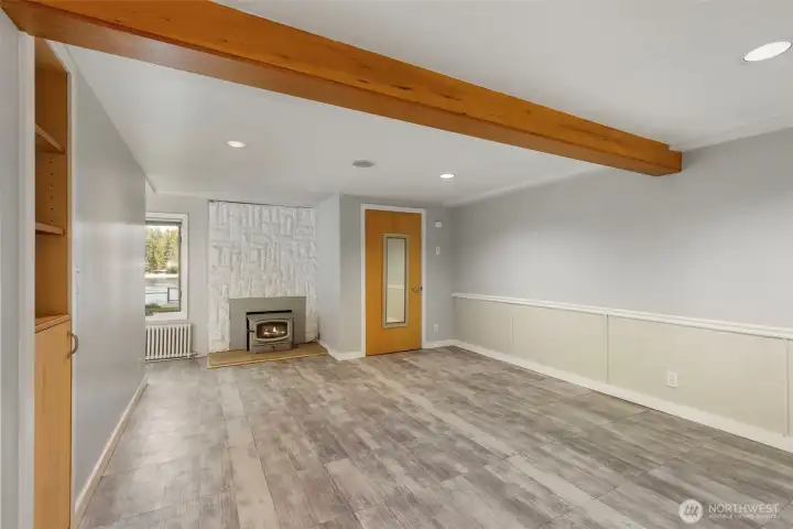 Downstairs great room with fireplace and door to back yard