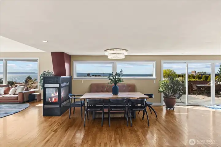 Elegant open concept dining with double sided gas fireplace