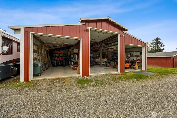 With the doors open, you can really appreciate the scale inside, and it is substantial. Storage for days, room for projects, equipment, hobbies, and then that tall center bay changes the conversation entirely. Boat, RV, taller rigs, workshop dreams that usually need a separate property, suddenly all seem possible. This is not just overflow space, this is functional square footage with real versatility. And because the doors and ceiling are insulated, keeping the space more comfortable while you work becomes a whole lot easier.