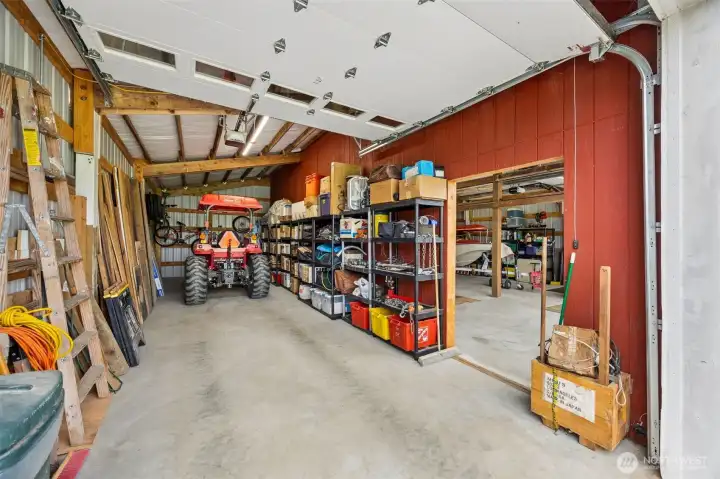 That interior separation wall creates a very useful division, letting one bay stay dedicated to storage while another becomes a true work zone if you want it. That kind of flexibility is gold. And then there is the infrastructure story, which is substantial. Sellers invested roughly $30,000 in electrical improvements, including trenched power to the barn, relocating the electric box to the left side of the property, new wiring for the well, plus a 50-amp generator setup already in place on the right side of the home. No generator included, but it is plumbed and ready, which means when the time comes, you plug in and go.