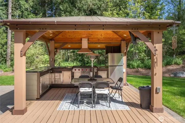 Outdoor kitchen area. Roll down shades not shown in photos.