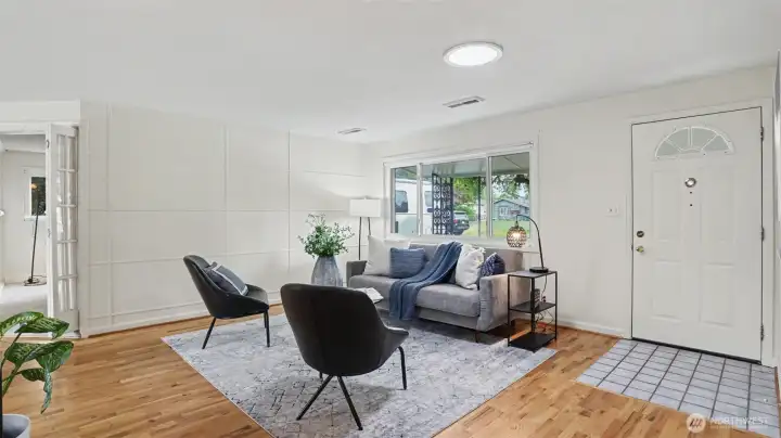 Walk-in to the light and bright living room with Oak floors. Walk-in to the light and bright living room with Oak floors.