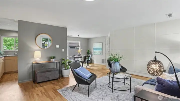 The living room is adjacent to the kitchen and dining rooms, and shares a wall with the additional bonus room. The living room is adjacent to the kitchen and dining rooms, and shares a wall with the additional bonus room.