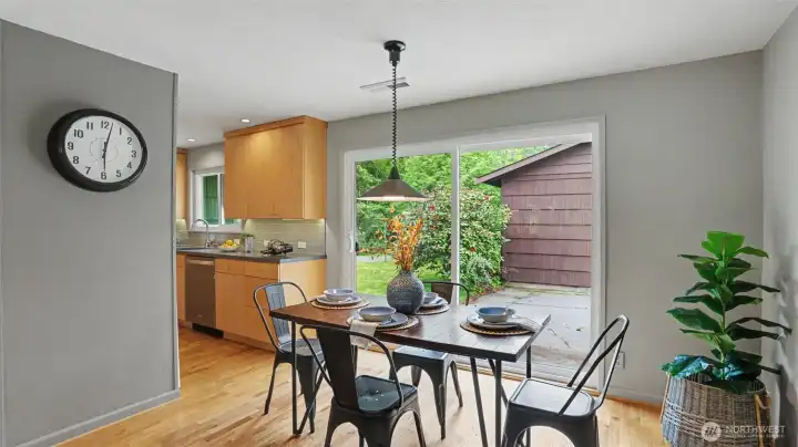 The dining room features sliders that lead out into the private back yard with detached garage. The dining room features sliders that lead out into the private back yard with detached garage.