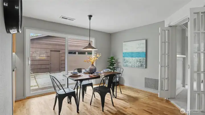 The kitchen flows into the dining room, which then flows into the living room, backyard, and bonus room. The kitchen flows into the dining room, which then flows into the living room, backyard, and bonus room.