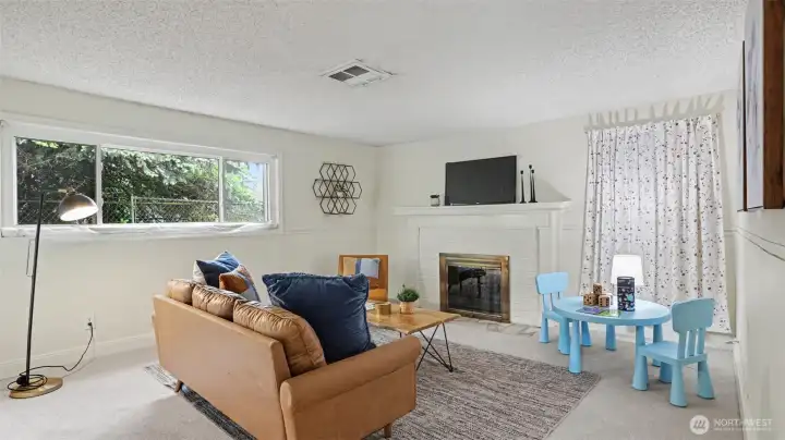 The bonus room boasts fresh new carpet as well as a cozy wood-burning fireplace with a new damper. The bonus room boasts fresh new carpet as well as a cozy wood-burning fireplace with a new damper.