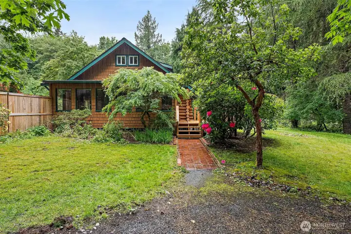 PNW turnkey log beauty! 2BD, 1.5BA, plus den and flex space, on .51 acres. Fully fenced and surrounded by lush foliage. PNW turnkey log beauty! 2BD, 1.5BA, plus den and flex space, on .51 acres. Fully fenced and surrounded by lush foliage.