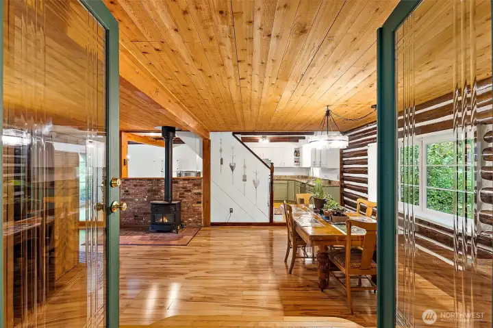 Beautiful brand new glass, double doors open to the stunning main living space of this log beauty. Beautiful brand new glass, double doors open to the stunning main living space of this log beauty.