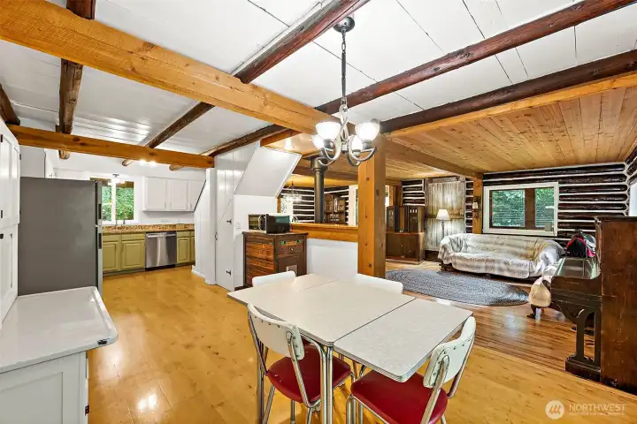 View from dinette into kitchen and living room. From every angle this home is stunning. View from dinette into kitchen and living room. From every angle this home is stunning.