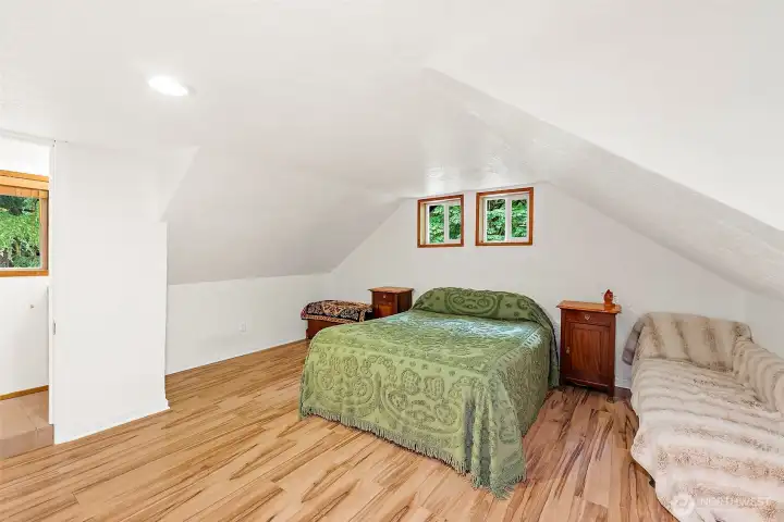 Spacious primary bedroom, brand new energy efficient windows above the bed. Spacious primary bedroom, brand new energy efficient windows above the bed.