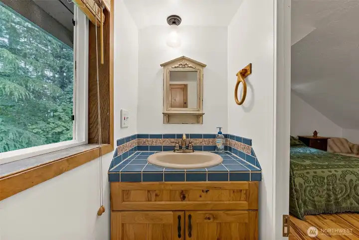 Functional 1/2 bath off the primary bedroom. Functional 1/2 bath off the primary bedroom.