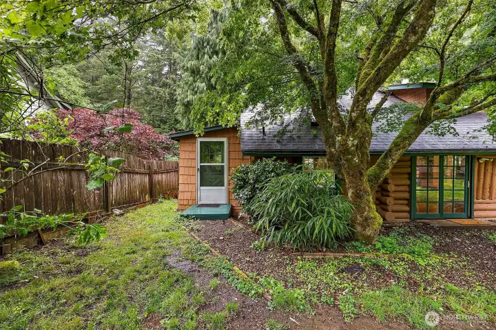View of back of the home, with door access to office/den. View of back of the home, with door access to office/den.