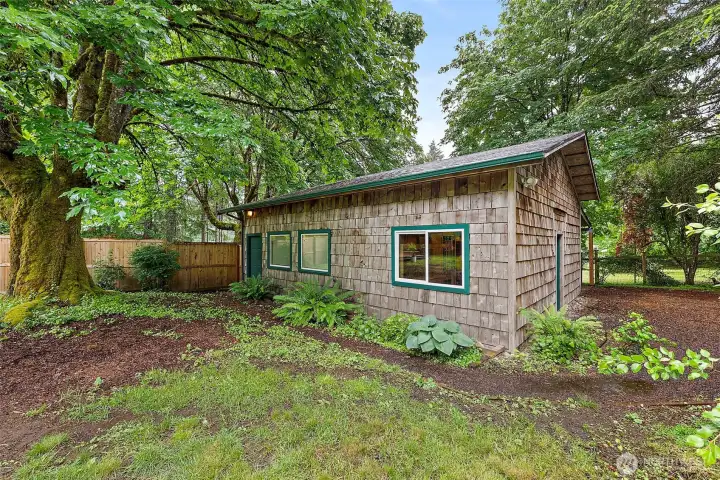Large detached 2 car garage. Door access on the side and back of the structure. Back door leads to the shop, which leads to inside the garage. Large detached 2 car garage. Door access on the side and back of the structure. Back door leads to the shop, which leads to inside the garage.