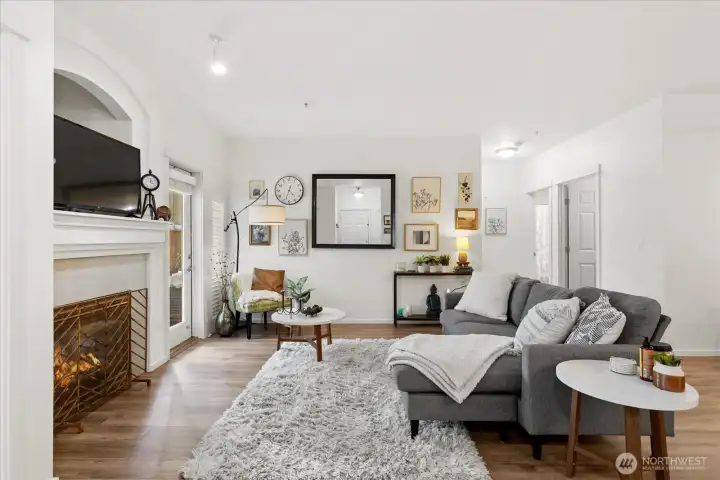 Spacious living room with gas fireplace.