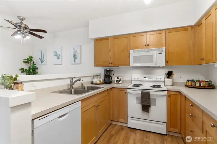 Kitchen boasts ample counter space & cabinetry.