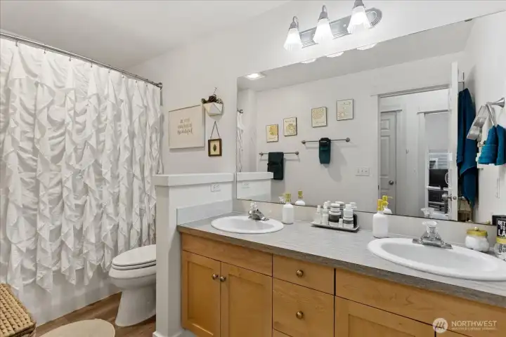 Full bathroom with double vanity.
