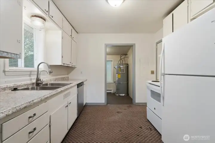 Kitchen area in Unit 1 showing counter space, cabinetry, and practical layout Kitchen area in Unit 1 showing counter space, cabinetry, and practical layout