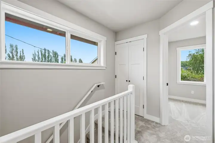 Washer/dryer behind door at top of stairs