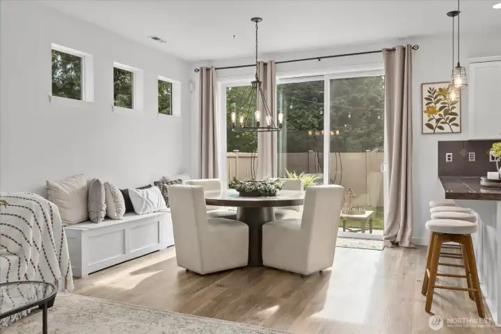 Open Concept living dining kitchen to sunny outdoor patio Open Concept living dining kitchen to sunny outdoor patio
