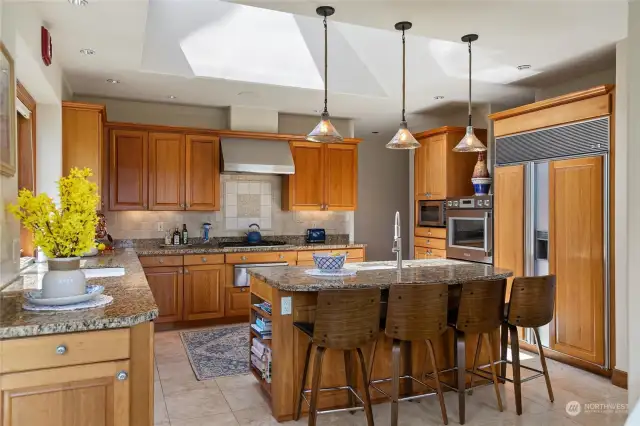 Kitchen has center island seating, granite counter tops and double ovens.
