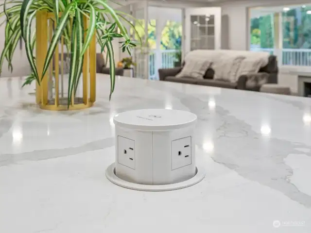 High tech feature - pop-up built-in phone charger and outlet station in the kitchen island