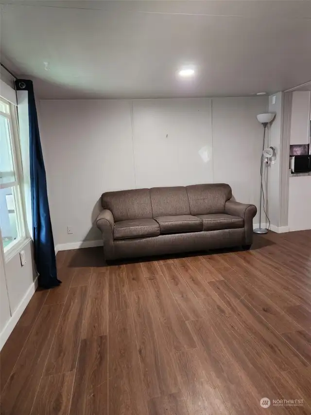 Living room with newer laminated flooring