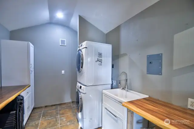 SHED WITH WASHER/DRYER TOILET, UTITLITY SINK WITH COUNTERS AND SPACIOUS CABINETS