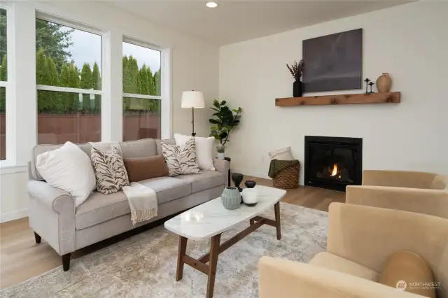 Great room w/gas fireplace & LVP flooring - Pics are of a different 2389 Kyler plan home. Features and colors may differ.