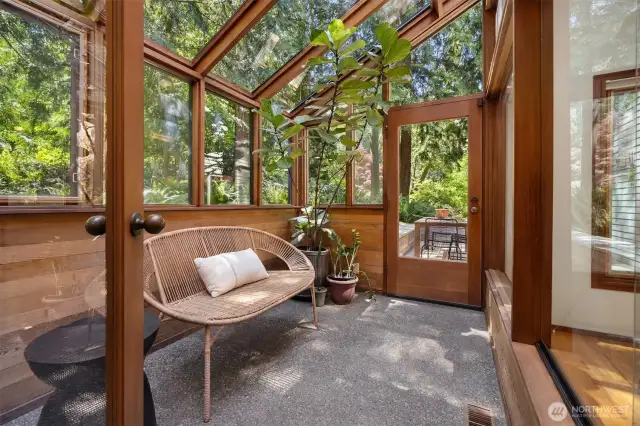 Bathe in natural light year-round in this tranquil sunroom off the kitchen