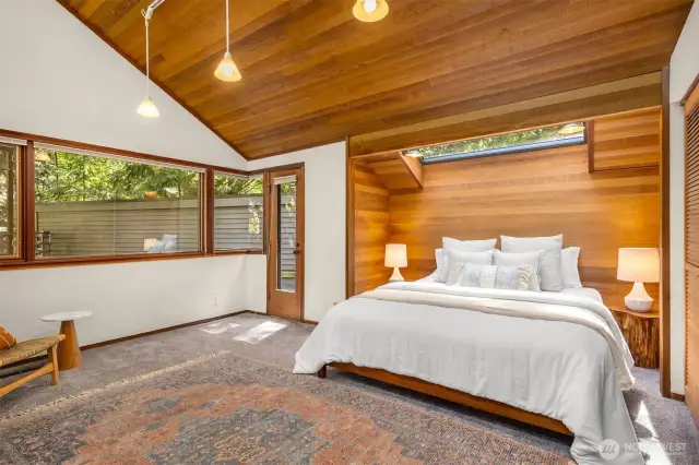 Upper Primary Suite with vaulted ceiling and ensuite