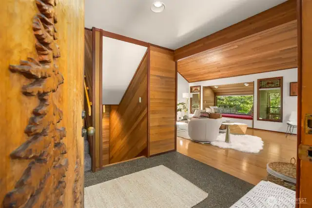 A custom door greets you as you enter this special home