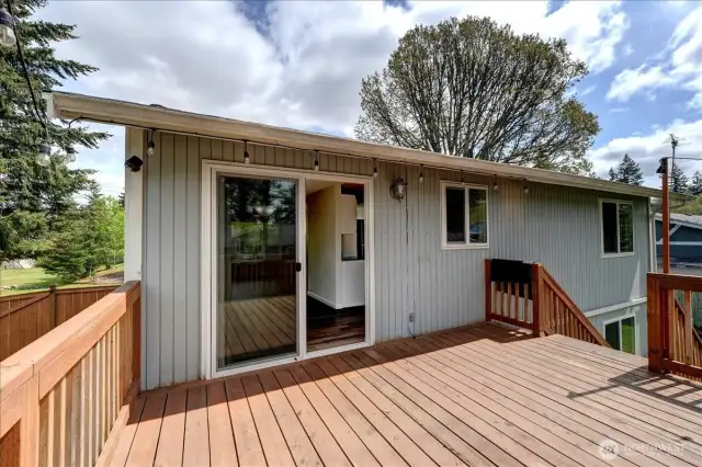 Wonderful deck just outside dining room with steps leading to fully fenced back yard