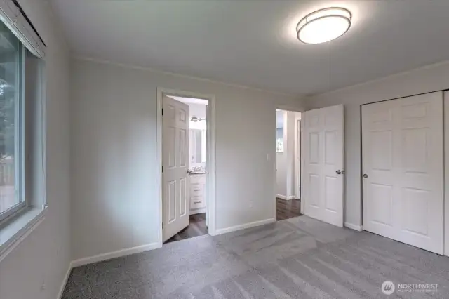 Primary bedroom with continental access to the full bath.