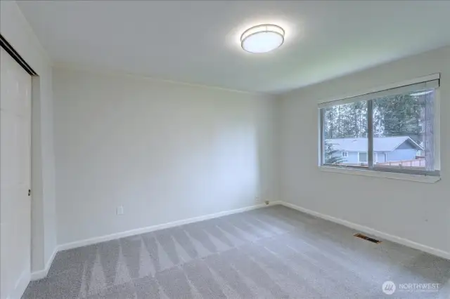 Reverse side of the primary bedroom. Note new carpeting!