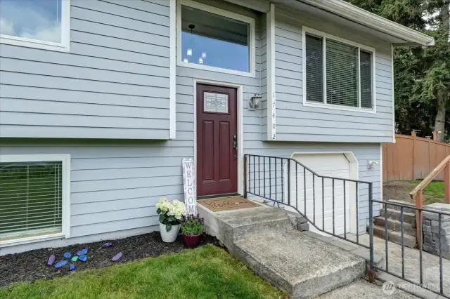 Recent fresh paint on exterior of home with newer welcoming front door