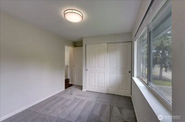 This is bedroom #2 on the upper/main floor. Notice the newer doors?