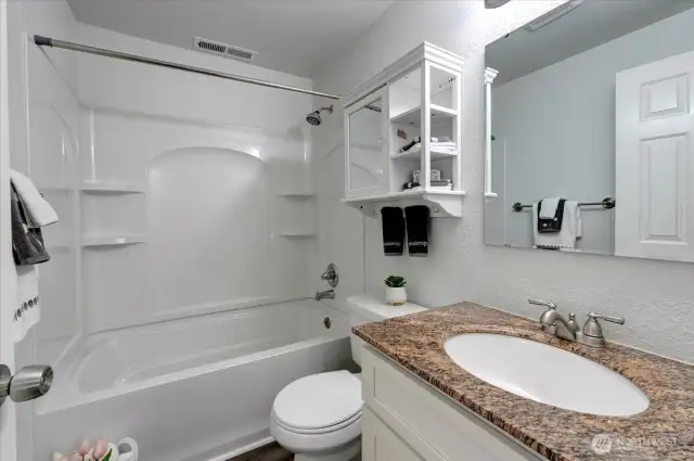 Another beautiful bathroom, this time on the lower level. Also with newer vanity and granite top.