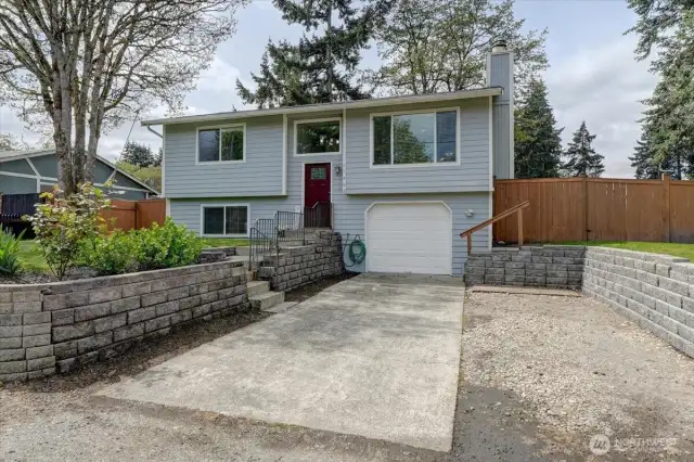 Seller's built the retaining walls, leveled the front yard, increased the parking area here. Whew ... BIG job!