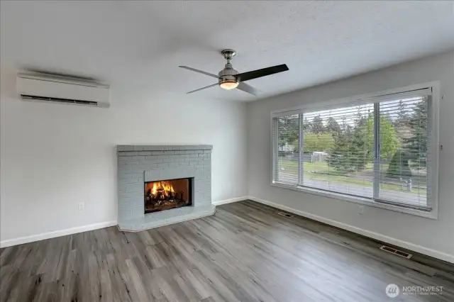 Your living room at top of stairs features welcoming woodburning fireplace (never used by these sellers), plus new mini-split for efficient heating and air conditioning