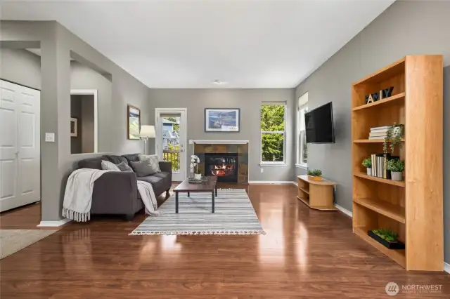 Family room with gas fireplace.   Access the wraparound deck off the family room or the entry.