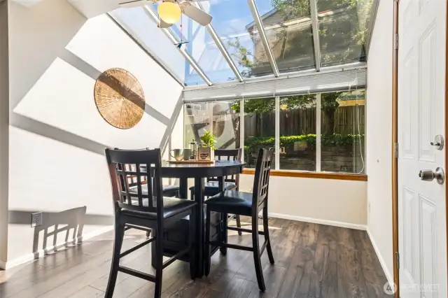 Love this dining nook with garden window! -- And the door out to the backyard for summer barbecues!