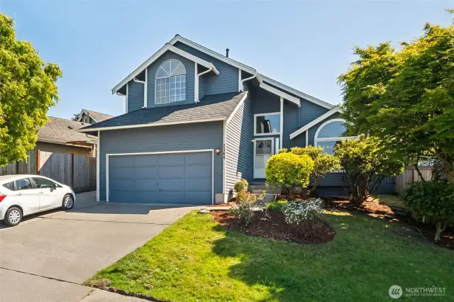 Two car garage with additional parking space to the side!
