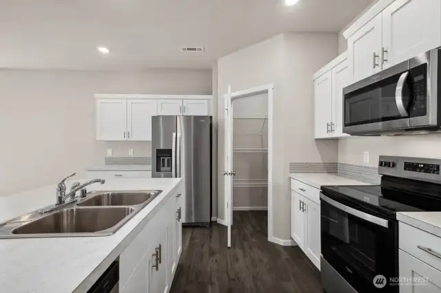 Photos are for representational purposes only.  Colors and finishes may vary. Refrigerator is a Builder Option.  Stove is gas, sink is undermount and counters are quartz.