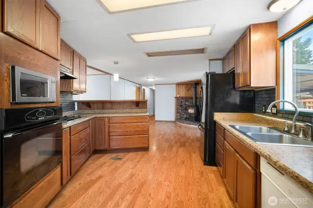 Kitchen with easy care laminate floors. All appliances stay.