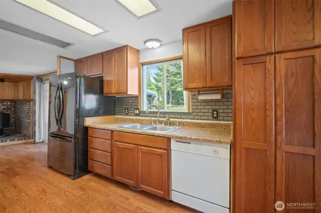 Kitchen sink overlooks the backyard; spacious pantry conveniently located to the right