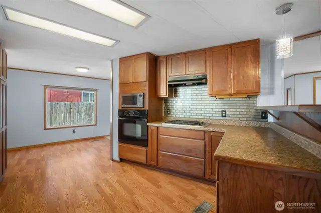 Enjoy cooking with a gas range, complemented by a tile backsplash and plenty of counter space.