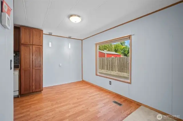 Conveniently situated between the kitchen and living room, the dining area offers a seamless flow.